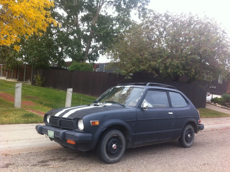 this car is parked on the side of the road