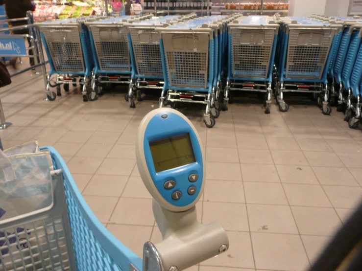 a row of carts with a digital display on them