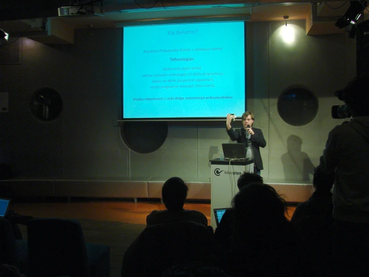 a man giving a lecture to a crowd