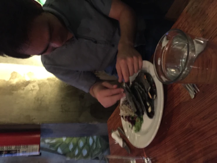 a man with a plate of food on his hand