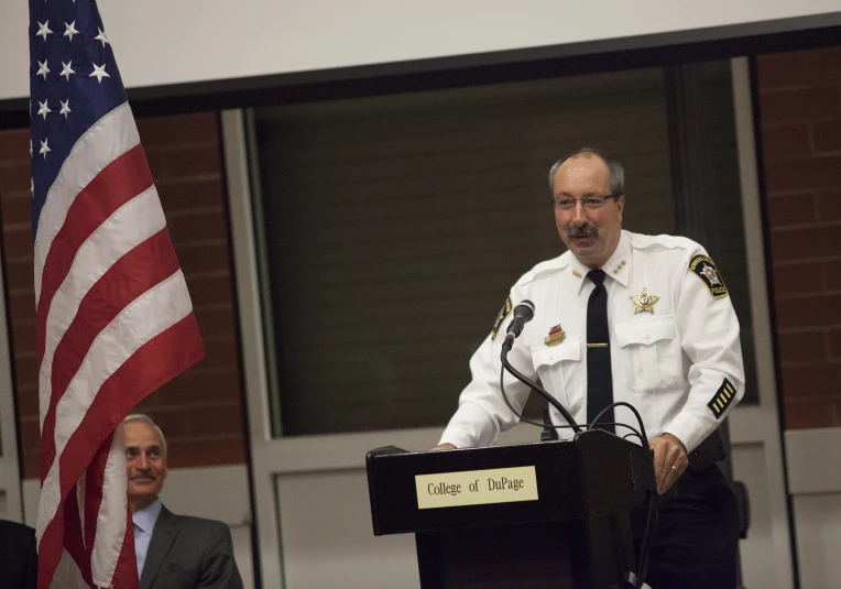 a cop is giving a speech at the podium