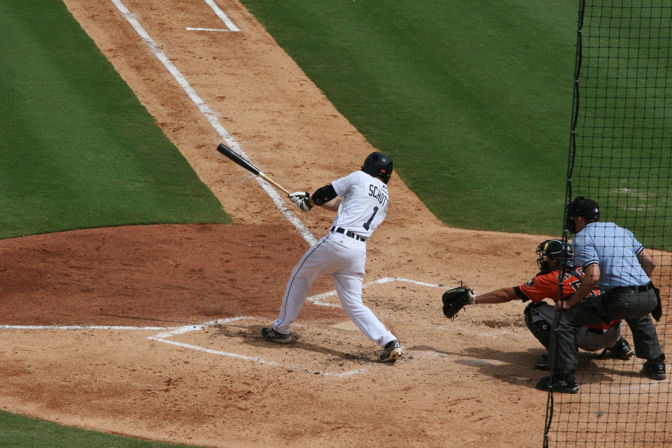 a batter hits the baseball during a baseball game