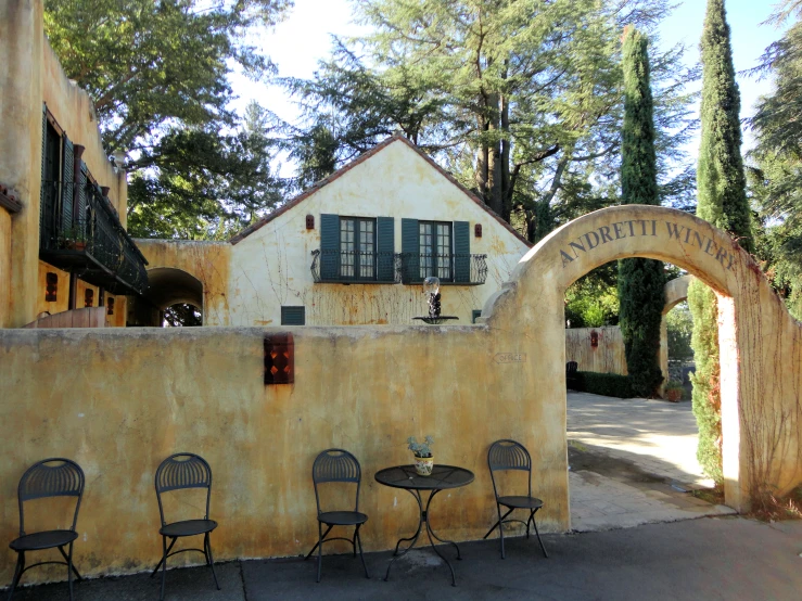 a building with four chairs in front of it