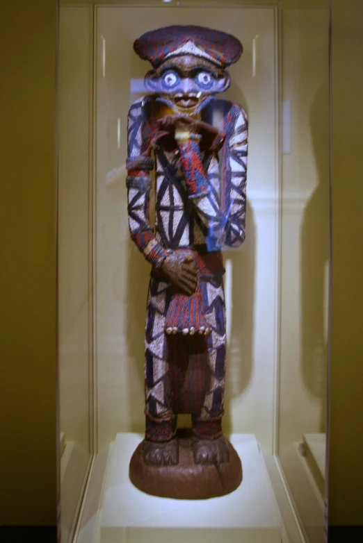 a sculpture of a person dressed in african print