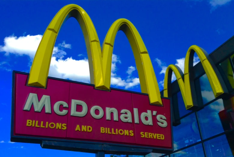 a big mcdonalds sign for $ 4 billion is shown against the sky
