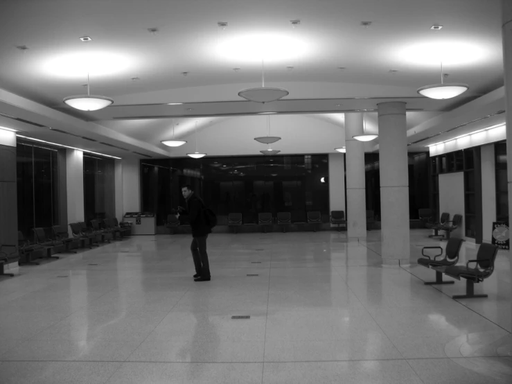 a man stands alone in an empty office