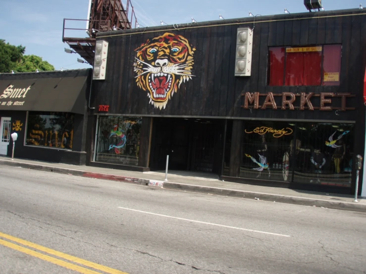 a street in front of a business with a tiger