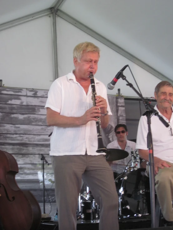 two men playing the same musical instrument