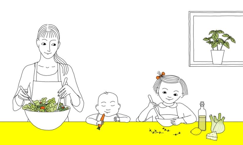 a woman, child and man are standing over a salad