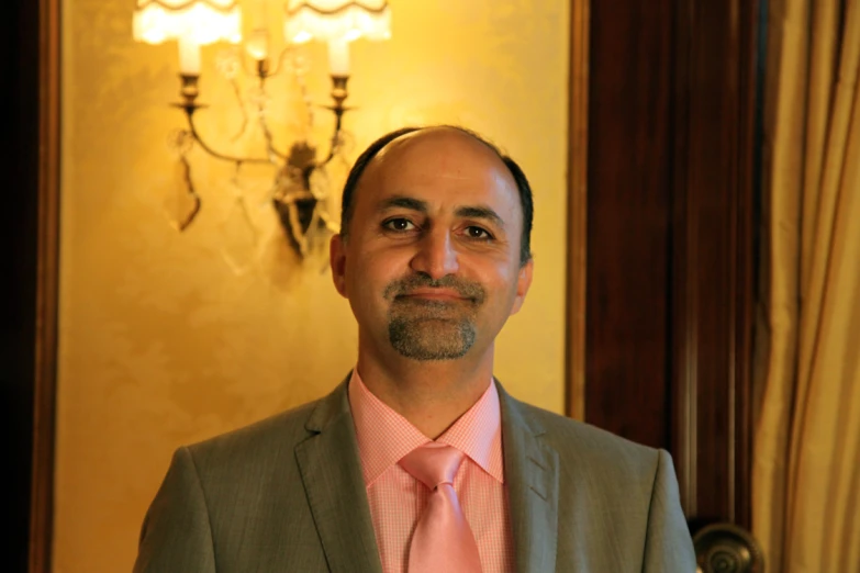 a man with a beard wearing a suit