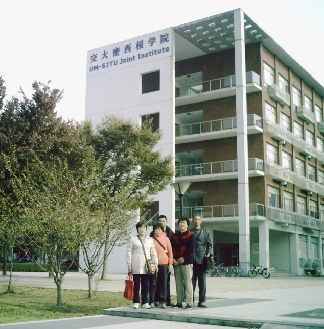a group of people standing in front of a building