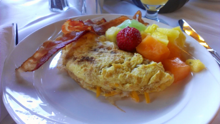 there is a breakfast plate on the dining table