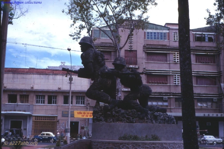 a statue stands in the middle of a square