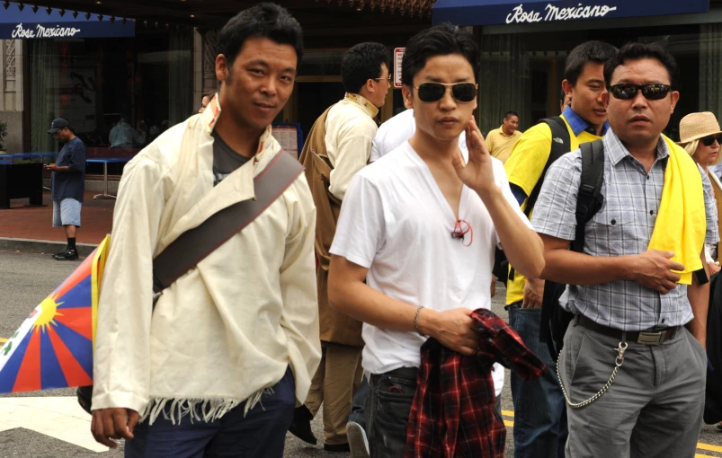 people walking on the street in a large group