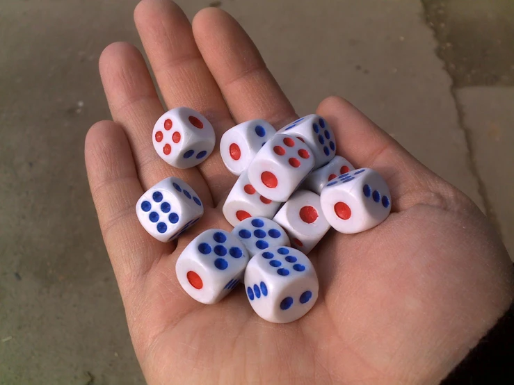 four dices and four spots that are on a person's palm