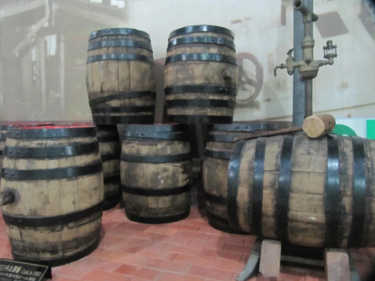 several wooden barrels stacked on top of each other