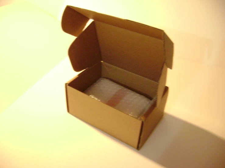 a box opened in front of a white backdrop