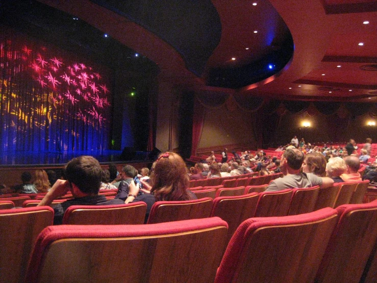 a large auditorium with rows of chairs