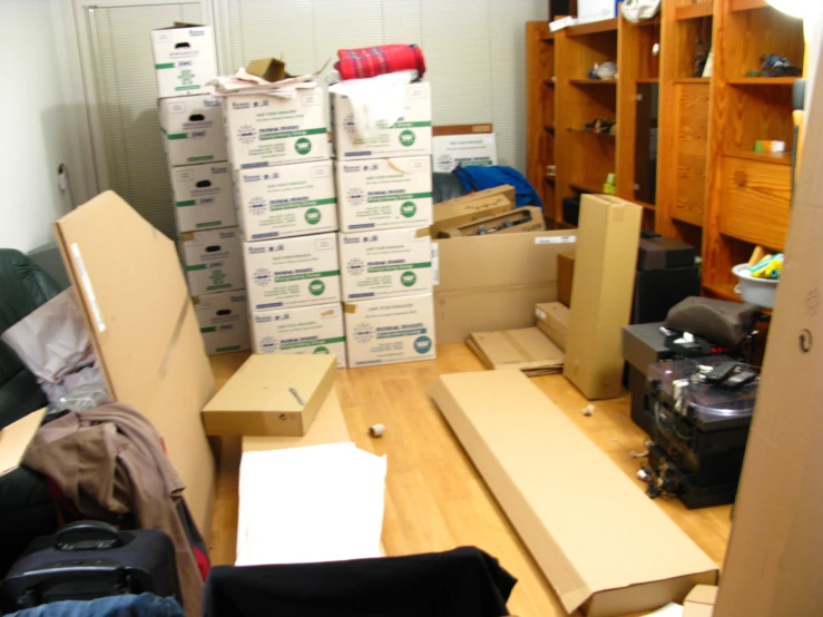 a room filled with boxes and bags of goods