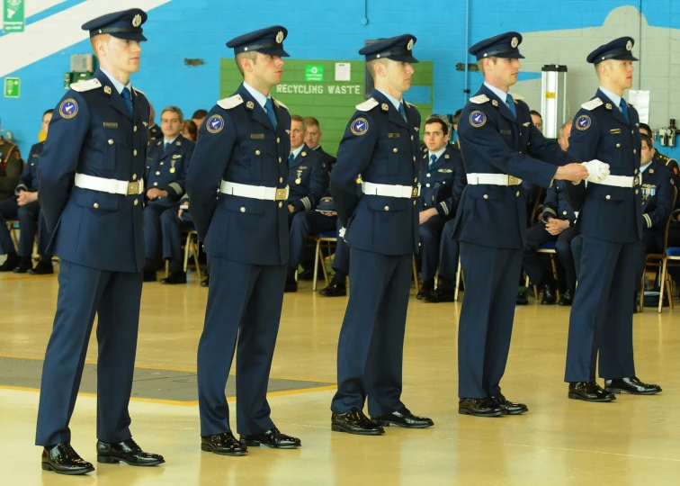 four military officers standing in a row