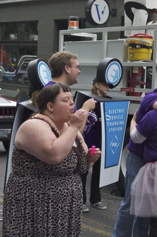 a woman standing in front of a group of people