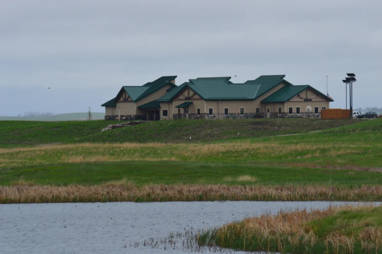 a house on a hillside, with many windows on the top