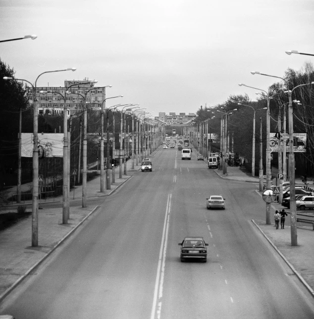 a city street with cars on it during the day