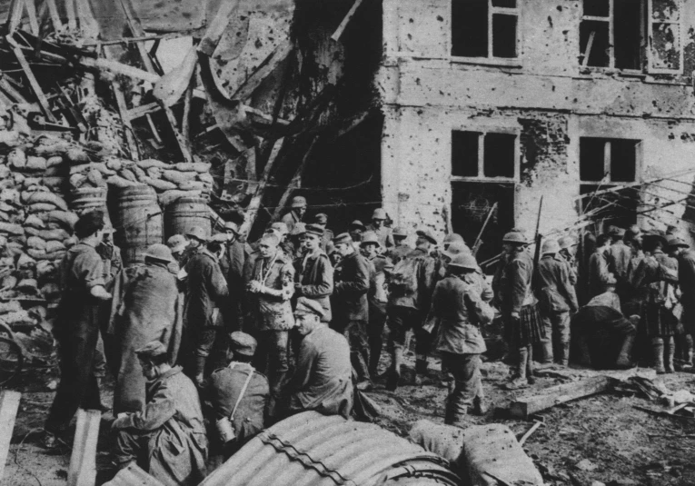 black and white pograph of soldiers gathered around building