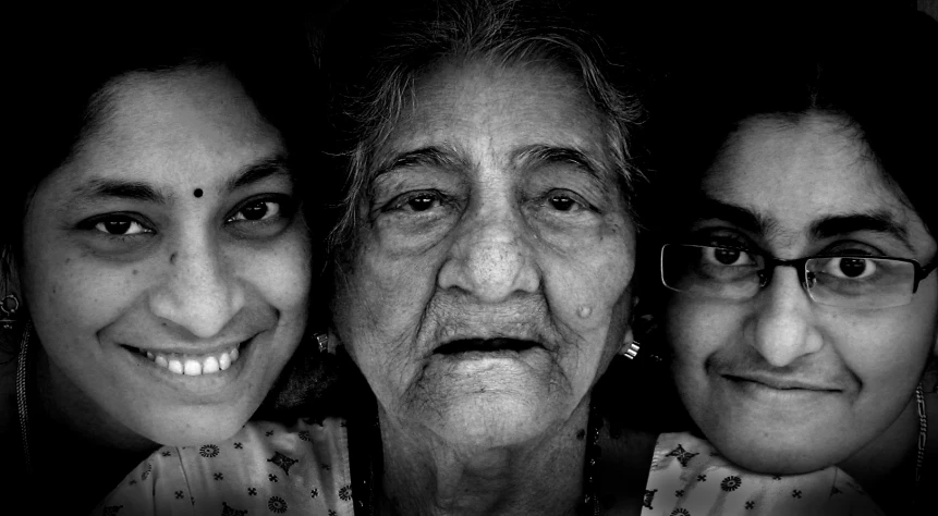 two women with a white shirt and one has black and white