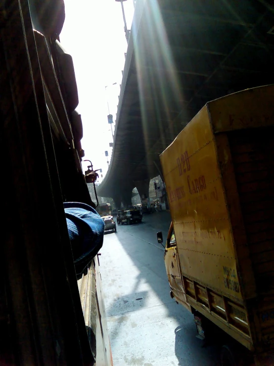 a person on a large truck behind some buildings