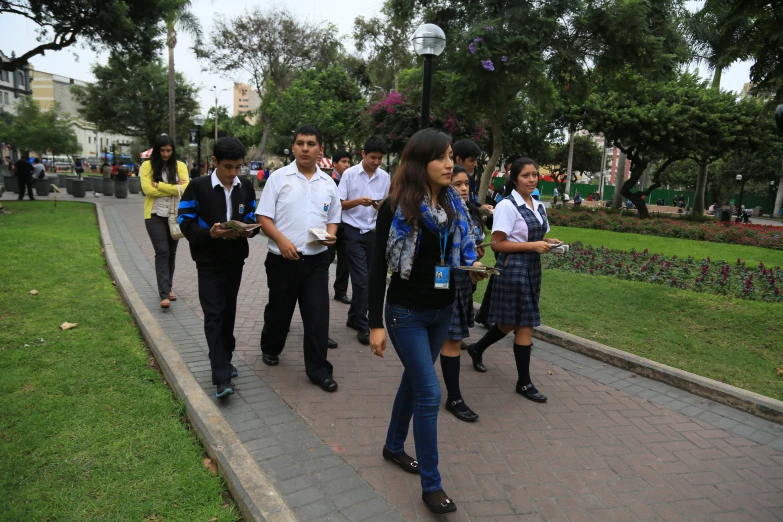 a group of people walking down a street