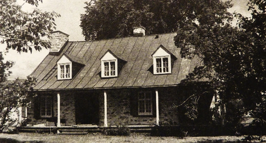 black and white pograph of an old country cottage