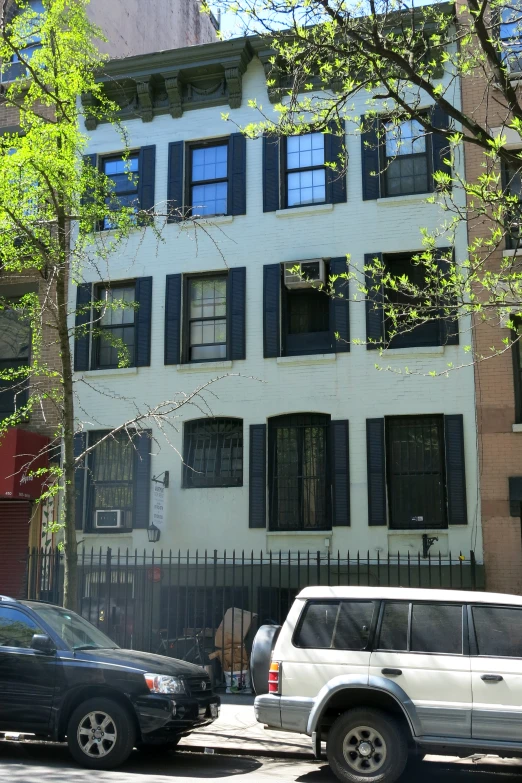 a three story building with lots of windows on the outside