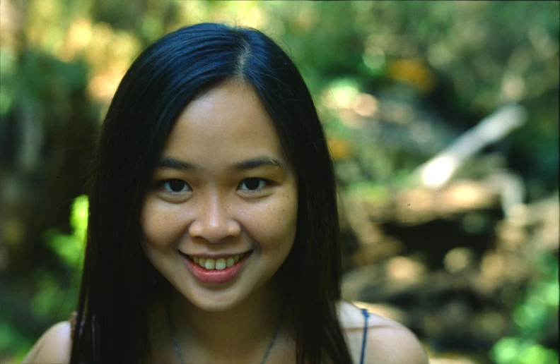 there is a young woman smiling and posing for a picture