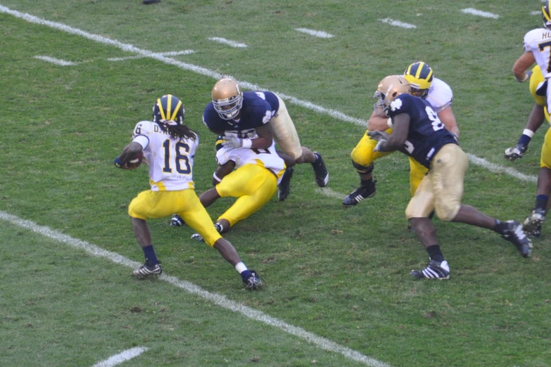 a football player running on to of the field