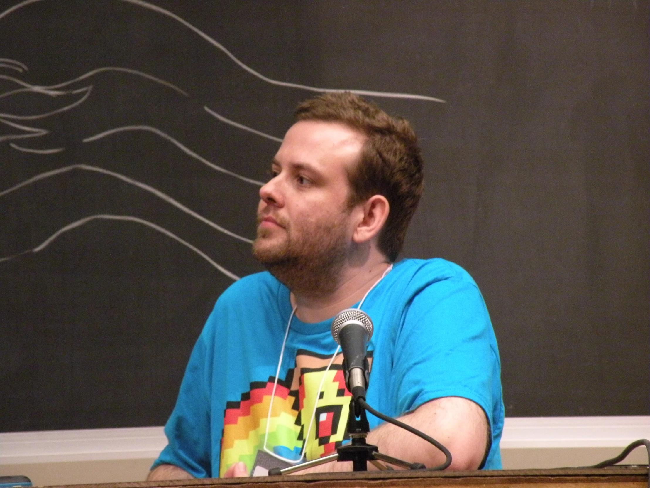 a man wearing headphones on a microphone