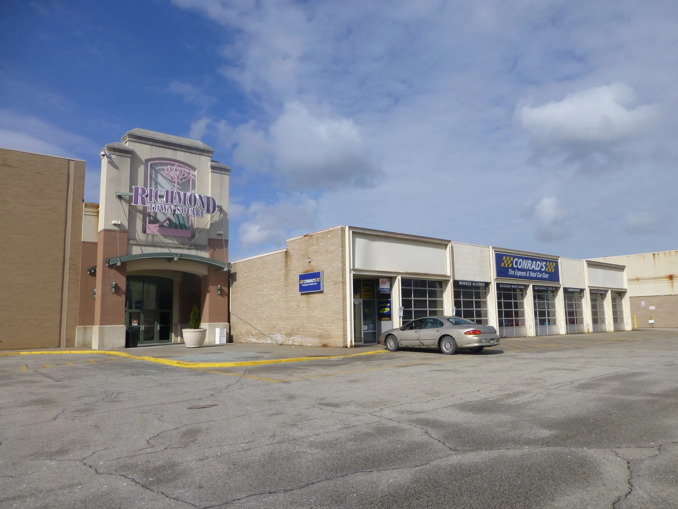 an empty parking lot in front of a building