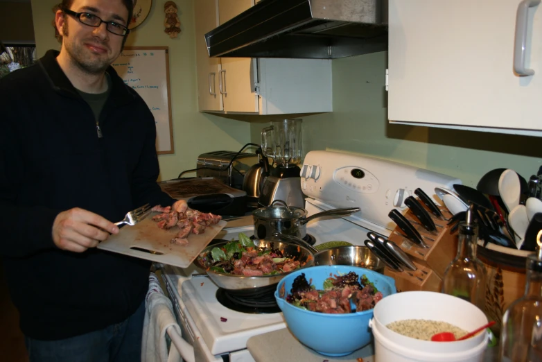 a man is preparing food on the kitchen counter
