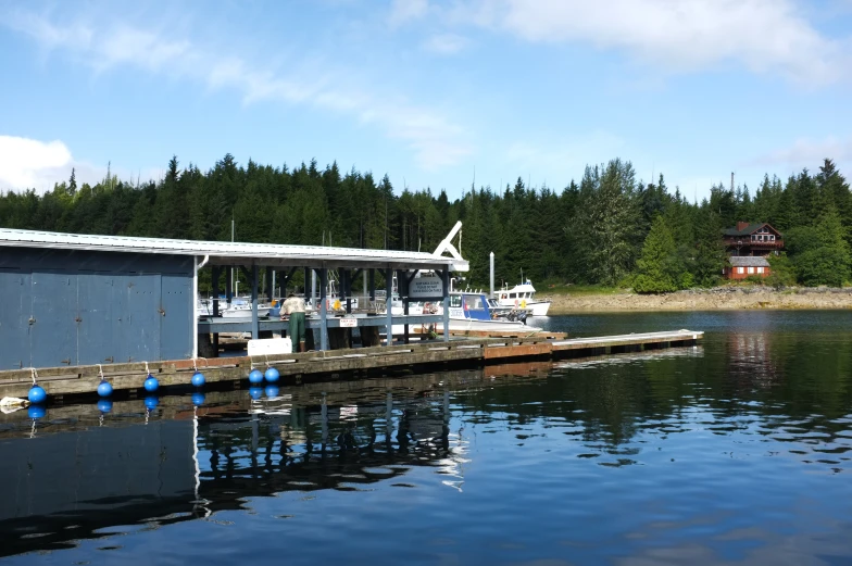 an island is close to the water with a boat tied up