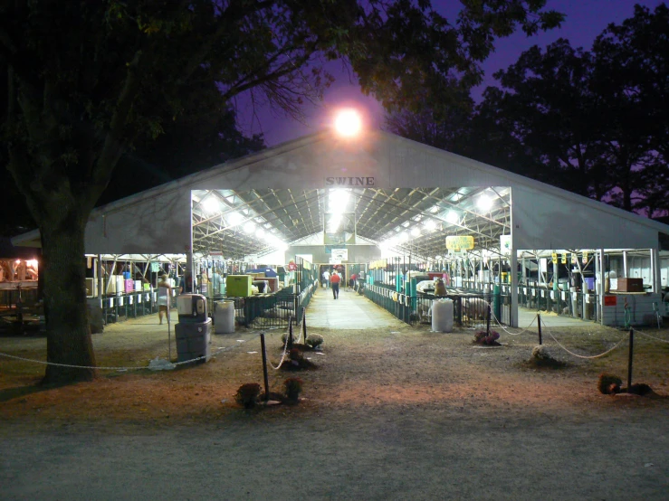 a large tent set up with light and music on stage