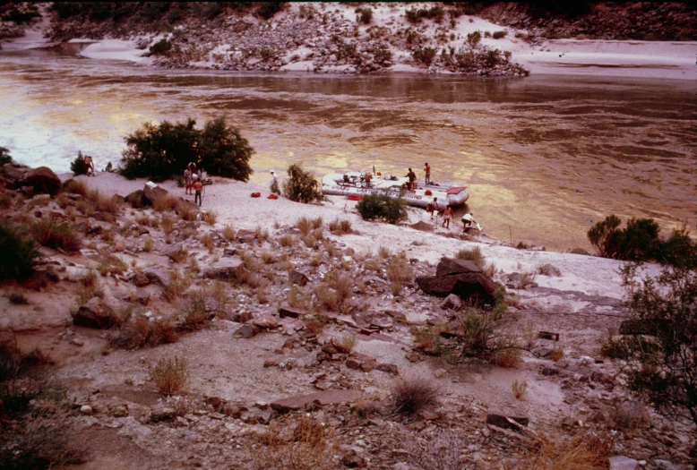 a couple of boats docked on top of a river