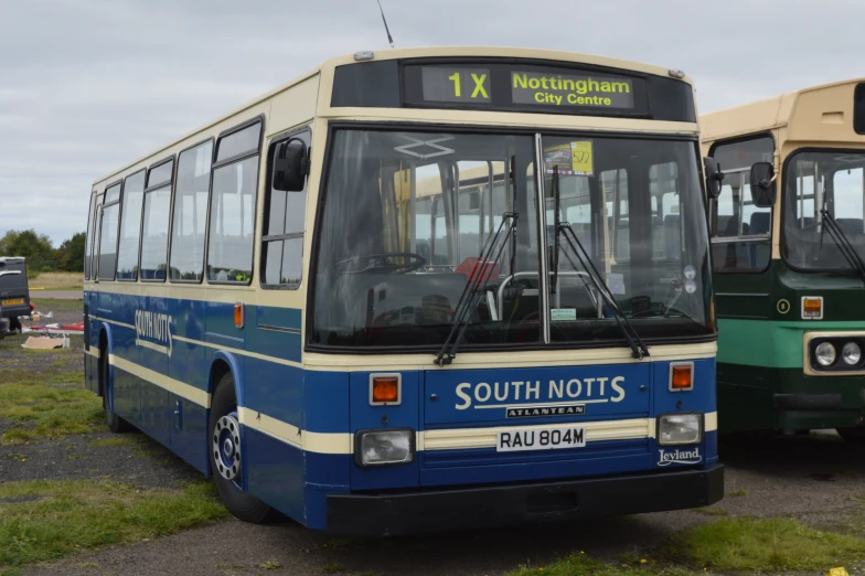 a couple of buses that are next to each other