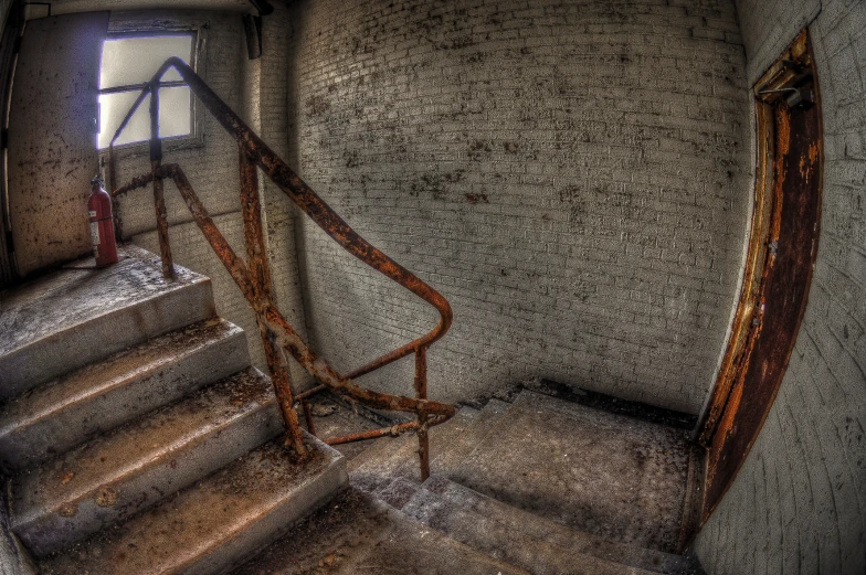 a large stair case sitting next to a window