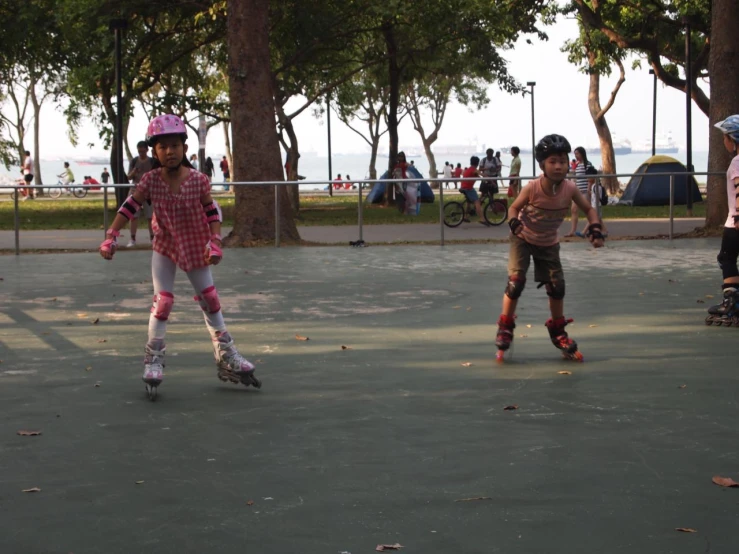 some young men playing skateboard on a park