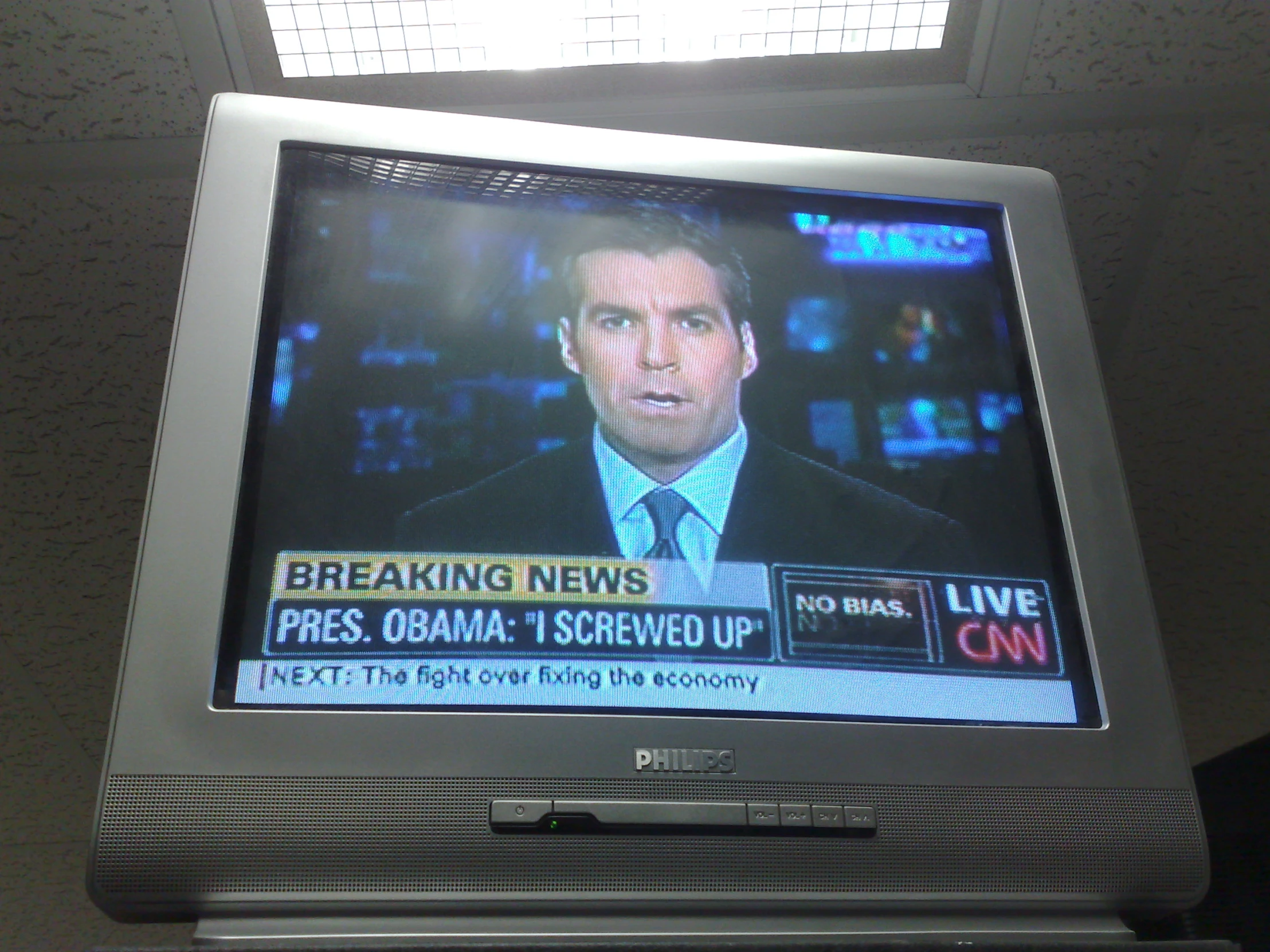 the tv is showing an old anchor for breaking news