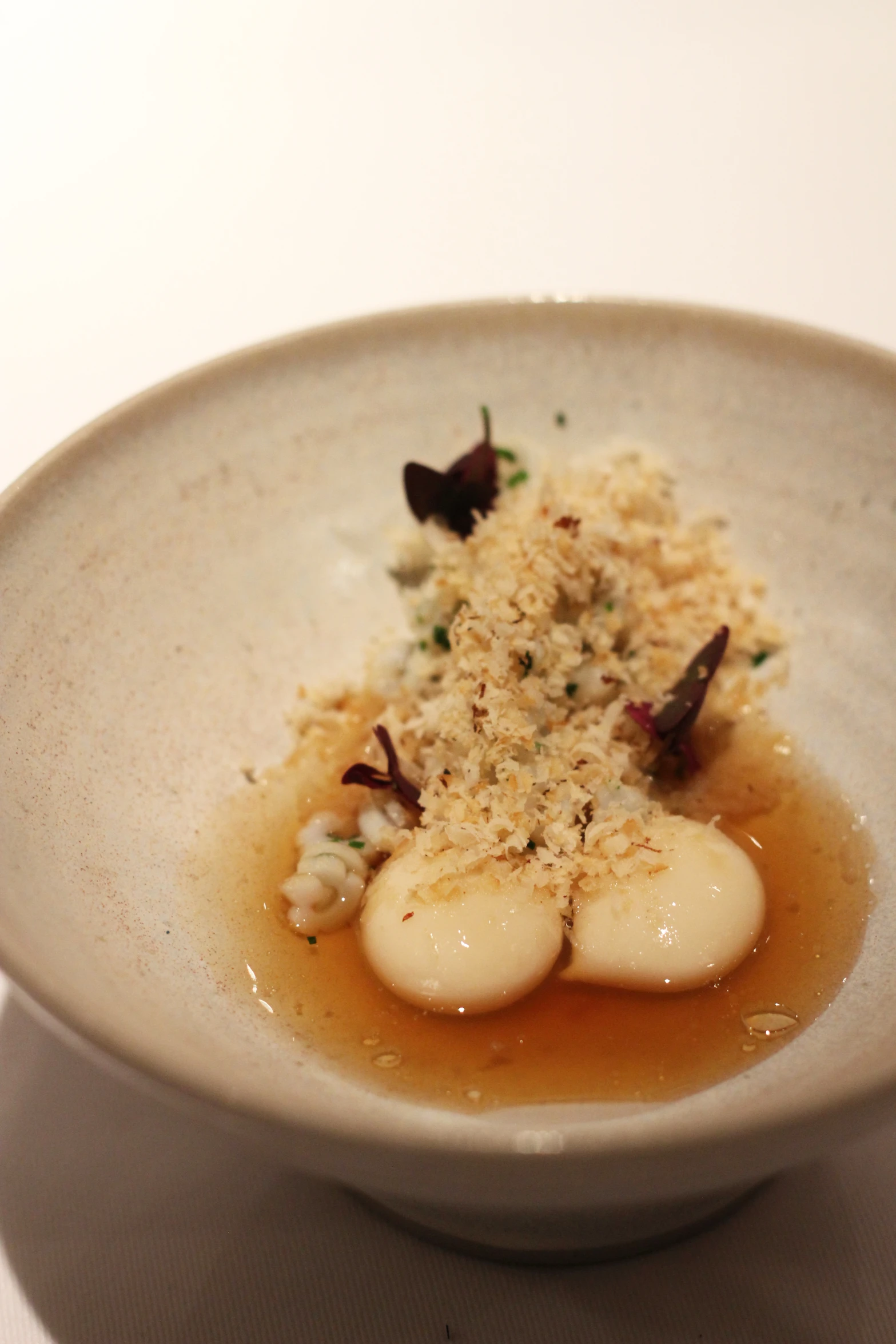 a white bowl full of some kind of food