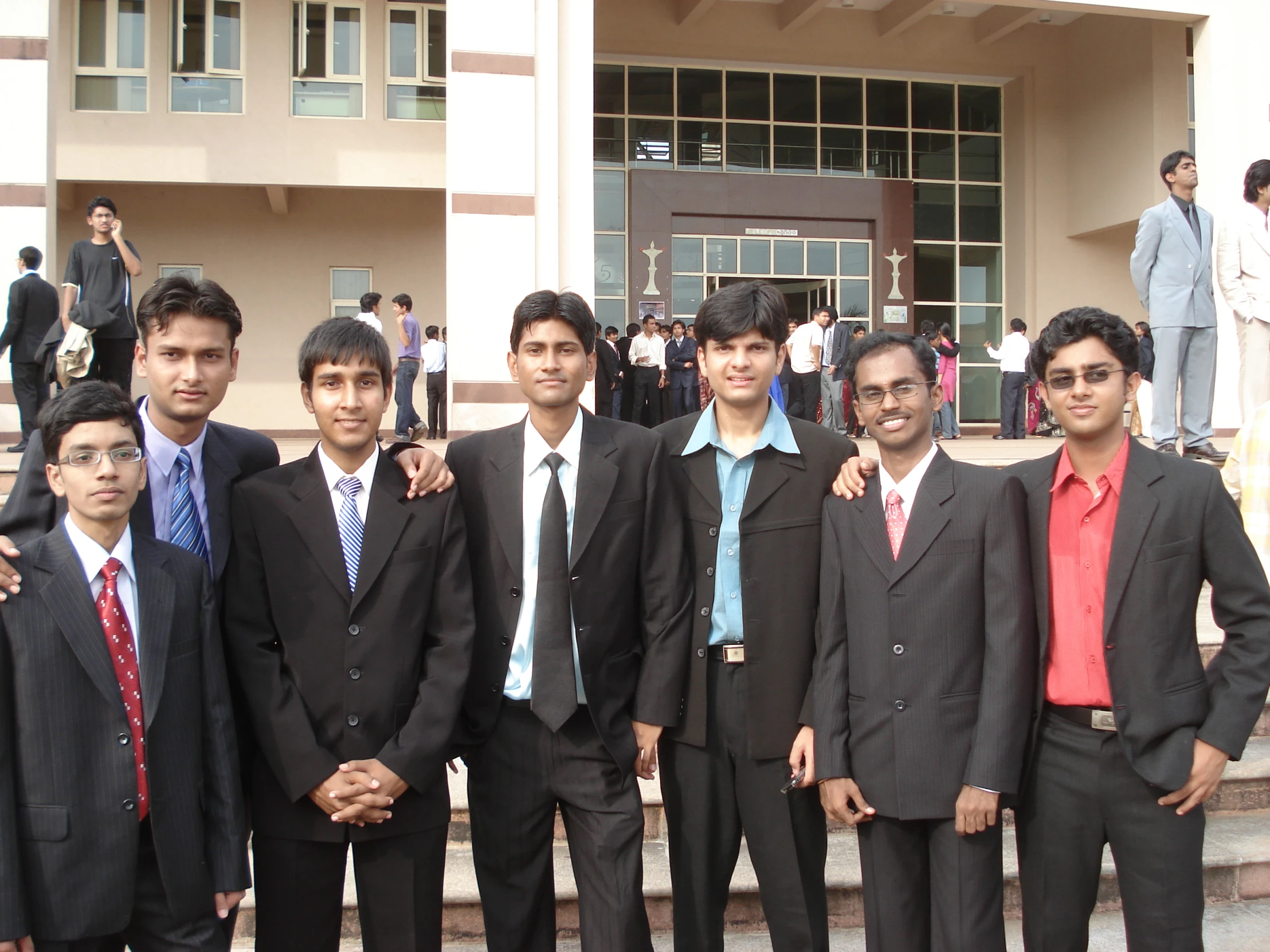 an image of a group of men standing on the stairs