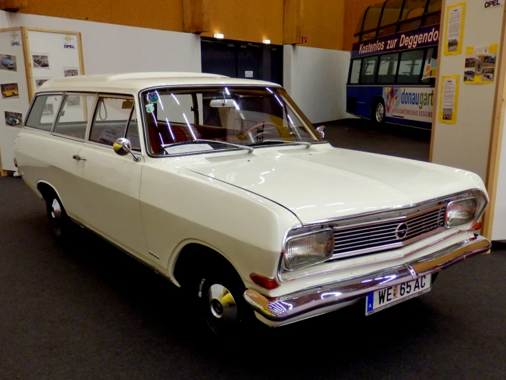 a station wagon in a garage with the door open