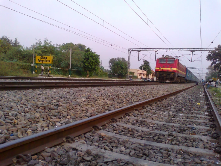 a train engine on train tracks in a rural town