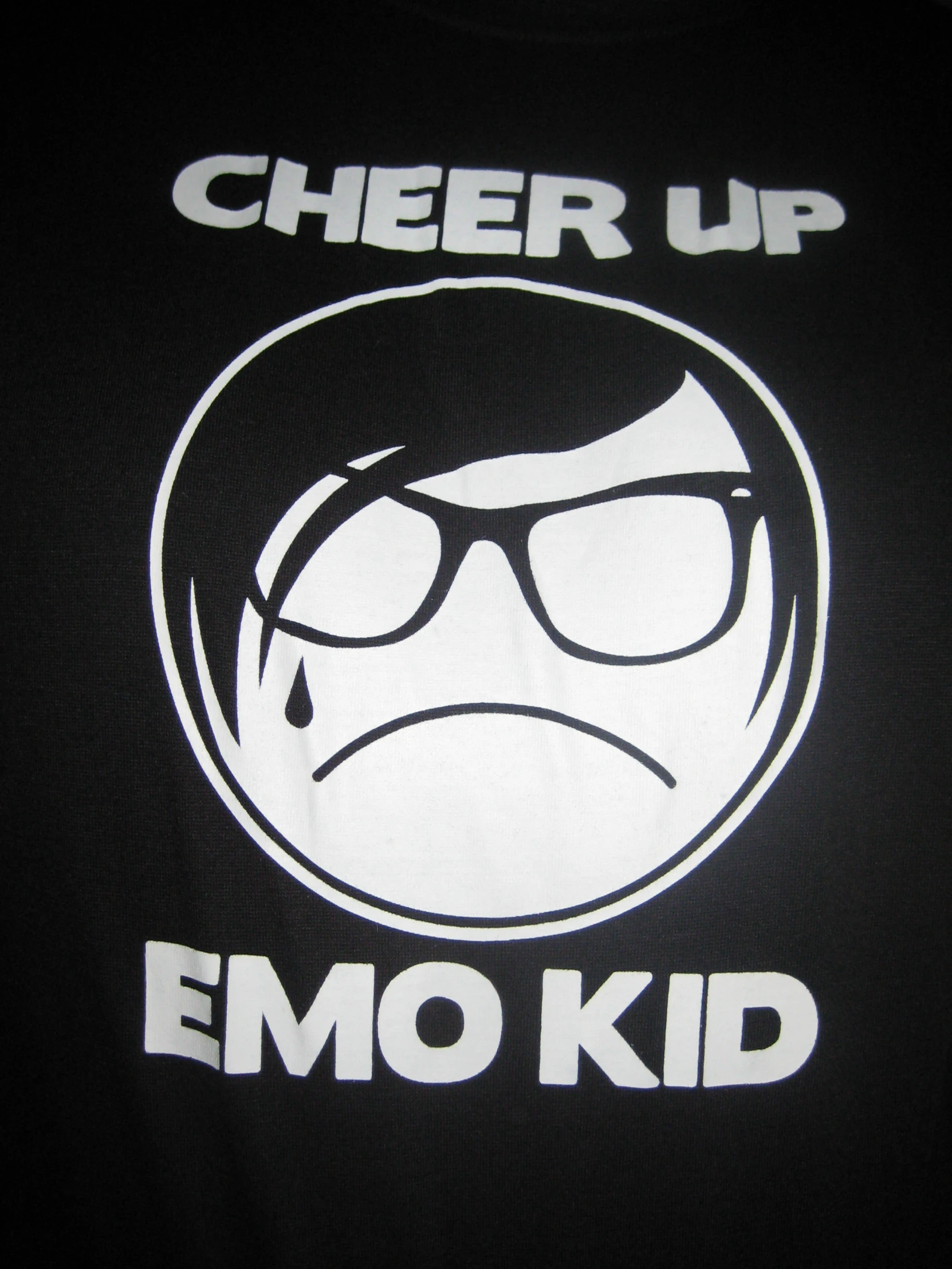 a shirt with an emo  face saying cheer up